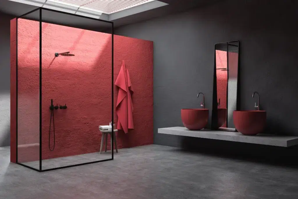 rénovation salle de bain petit budget - salle de bain en béton avec un mur en enduit béton décoratif de couleur rouge